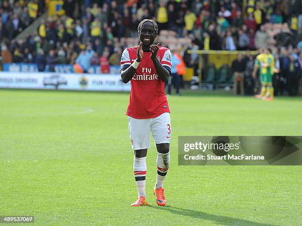 Bacary Sagna applauds the Arsenal fans after the Barclays Premier League match between Norwich City and Arsenal at Carrow Road on May 11, 2014 in...