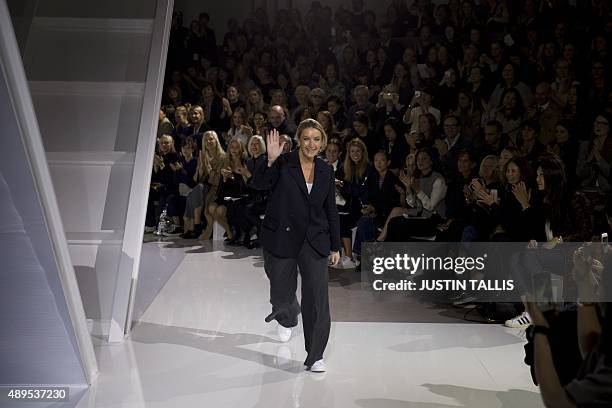 Fashion designer Anya Hindmarch waves to the audience after displaying her 2016 Spring / Summer collection at London Fashion Week in London on...