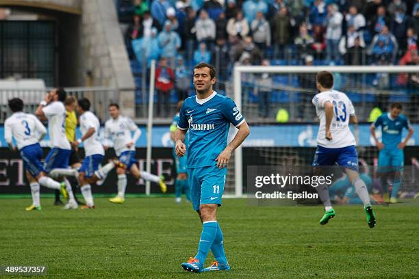 Aleksandr Kerzhakov of FC Zenit St. Petersburg reacts as FC Dynamo Moscow players celebrate a goal during the Russian Football League Championship...