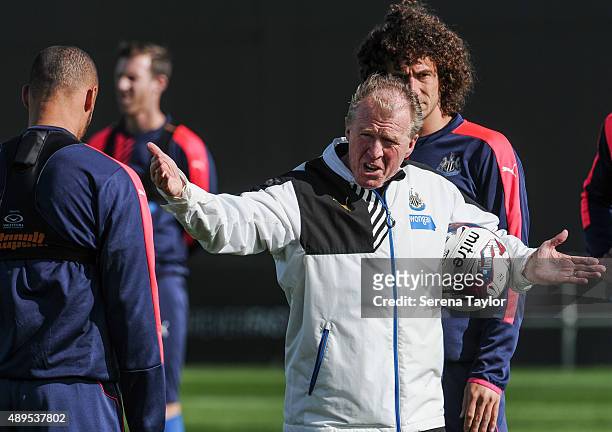 Newcastle's Head Coach Steve McClaren holds a ball under arm whilst pointing his hands and speaking to Yoan Gouffran during a Newcastle United...