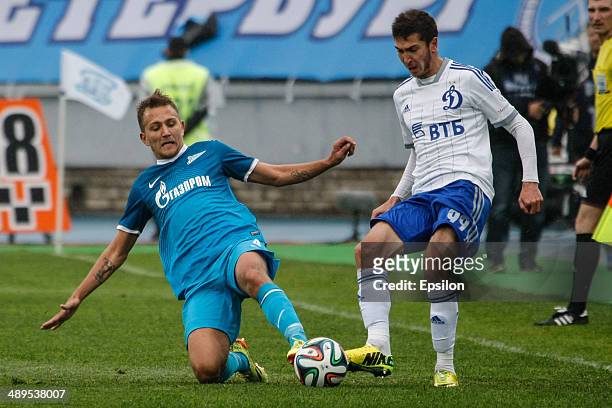 Domenico Criscito of FC Zenit St. Petersburg and Aleksei Ionov of FC Dynamo Moscow vie for the ball during the Russian Football League Championship...