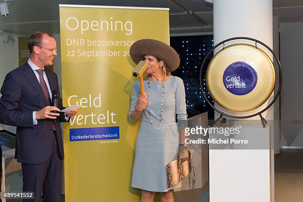 Queen Maxima of The Netherlands stands next to Netherlands Bank President before opening the new visitor center of the Netherlands Bank on September...