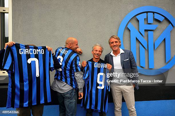 Aldo Baglio, Giacomo Poretti, Giovanni Storti and head coach of FC Internazionale Roberto Mancini pose before the FC Internazionale Training session...