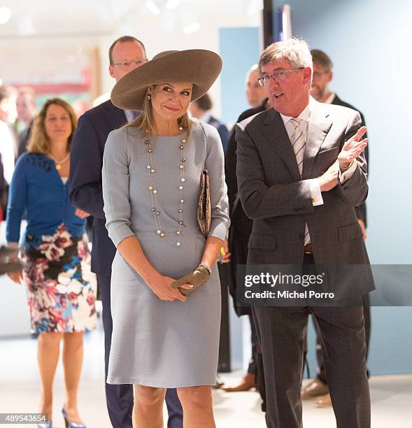 Queen Maxima of The Netherlands walks with Ton Lansdaal after opening the new visitor center of the Netherlands Bank on September 22, 2015 in...