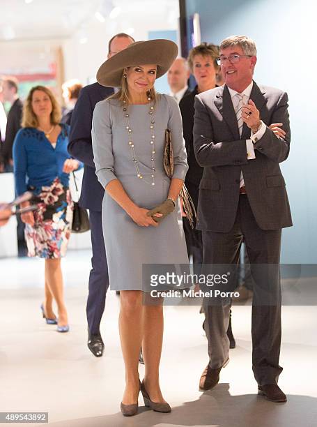 Queen Maxima of The Netherlands walks next to Ton Lansdaal after opening the new visitor center of the Netherlands Bank on September 22, 2015 in...