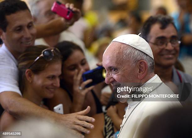Pope Francis holds an encounter with families at the Cathedral of Our Lady of the Assumption in Santiago de Cuba, in eastern Cuba, on September 22,...