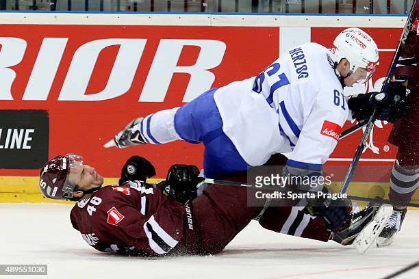 Fabrice Herzog of the ZSC Lions Zurich and Petr Kumstat from HC Sparta Prague fall on the ice during the Champions Hockey League round of thirty-two...