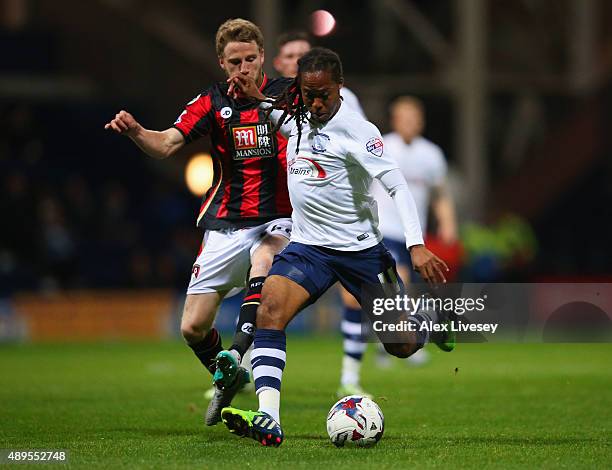 Daniel Johnson of Preston North End holds off Eunan O'Kane of Bournemouth during the Capital One Cup third round match between Preston North End and...