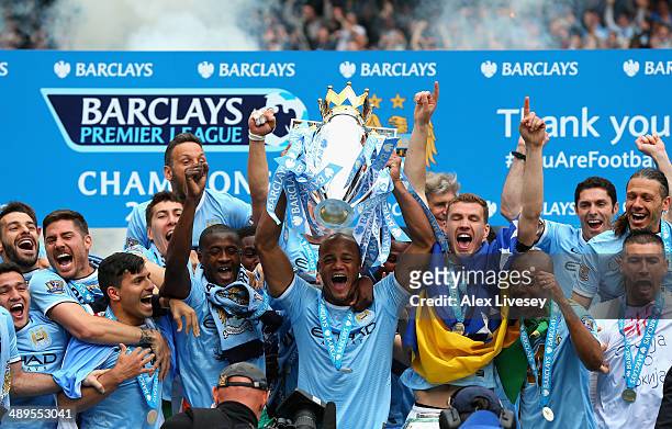 Vincent Kompany of Manchester City lifts the Premier League trophy at the end of the Barclays Premier League match between Manchester City and West...