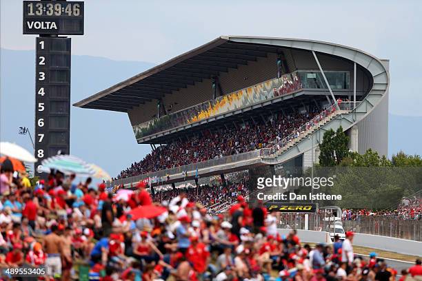 Fans line the track and pack the grandstand during the Spanish Formula One Grand Prix at Circuit de Catalunya on May 11, 2014 in Montmelo, Spain.