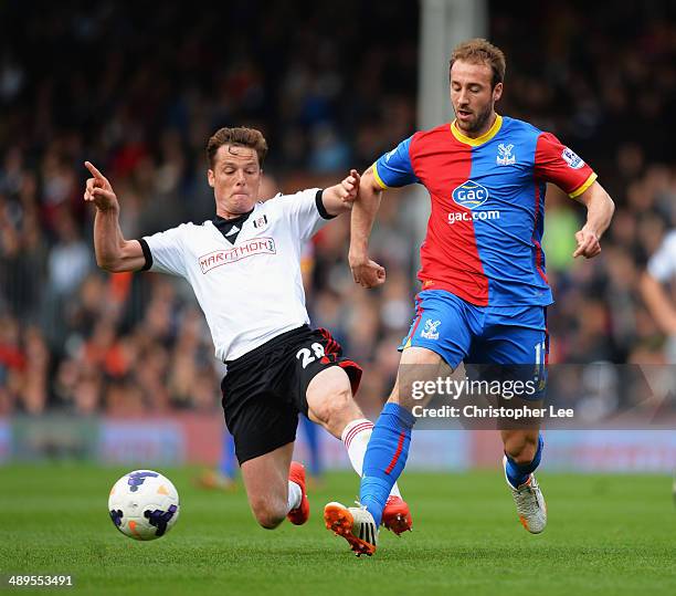 Glenn Murray of Crystal Palace is tackled by Scott Parker of Fulham during the Barclays Premier League match between Fulham and Crystal Palace at...