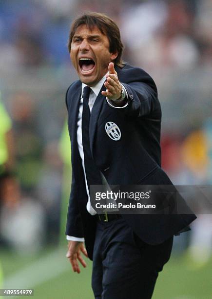 Juventus head coach Antonio Conte reacts during the Serie A match between AS Roma and Juventus at Stadio Olimpico on May 11, 2014 in Rome, Italy.
