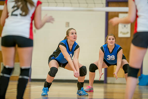 ready to recieve the ball - girls volleyball stock pictures, royalty-free photos & images