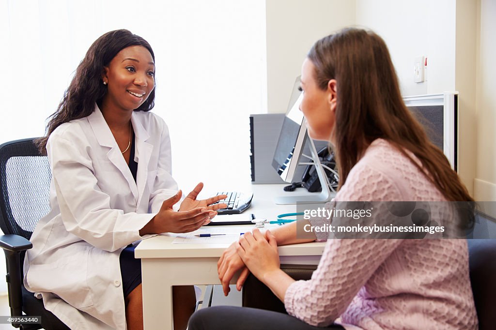 Patient Having Consultation With Female Doctor In Office