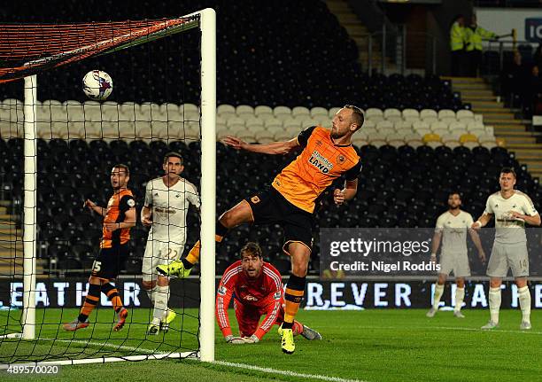 David Meyler of Hull City scores their opening goal during the Capital One Cup third round match between Hull City and Swansea City at KC Stadium on...