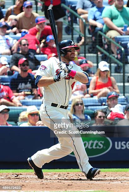 Ryan Doumit of the Atlanta Braves singles to knock in a second inning run against the Chicago Cubs at Turner Field on May 11, 2014 in Atlanta,...