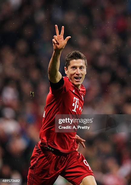 Robert Lewandowski of Bayern Munich celebrates scoring his 3rd goal during the Bundesliga match between FC Bayern Muenchen and VfL Wolfsburg at...