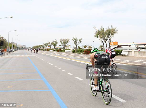 Participants follow the sea front in the cycle leg of the race during the Challenge Triathlon Rimini on May 11, 2014 in Rimini, Italy.