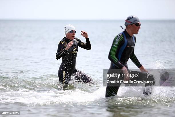 Participants exit the water after the swim leg during the Challenge Triathlon Rimini on May 11, 2014 in Rimini, Italy.