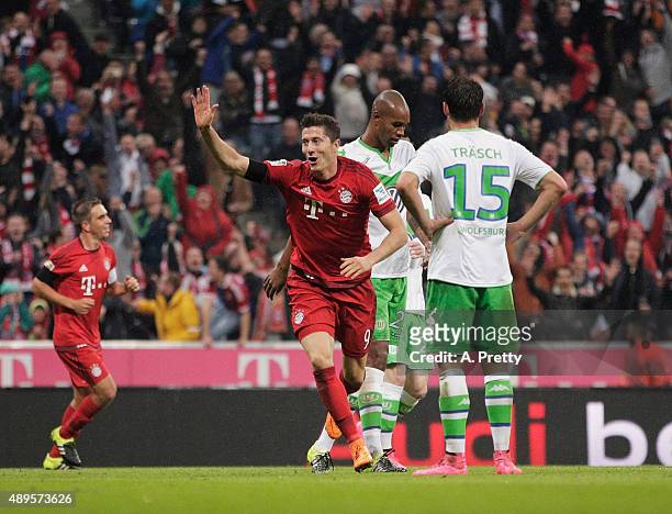 Robert Lewandowski of Bayern Munich celebrates after scoring his 5th goal during the Bundesliga match between FC Bayern Muenchen and VfL Wolfsburg at...