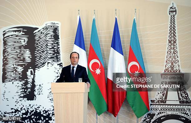 French President Francois Hollande delivers a speech during the inauguration of the new French school of Ville Blanche on May 11, 2014 in Baku....