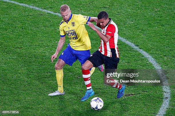 Adam Maher of PSV battles for the ball with Vytautas Andriuskevicius of Cambuur during the KNVB Cup 2nd round match between PSV Eindhoven and SC...