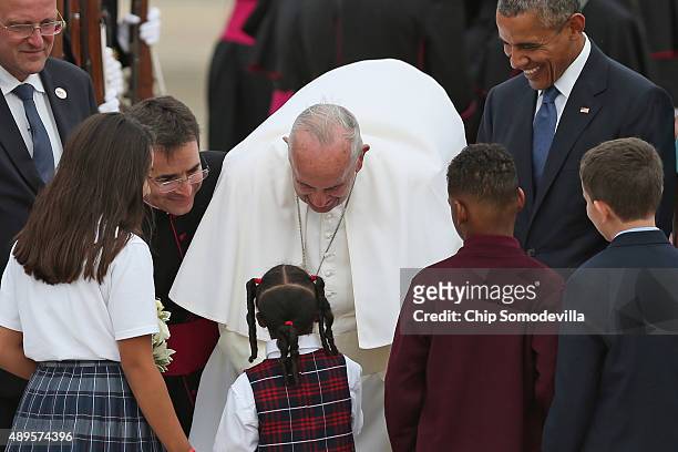 Pope Francis is greeted by a group of Catholic school children after being welcomed by U.S. President Barack Obama and other political and Catholic...