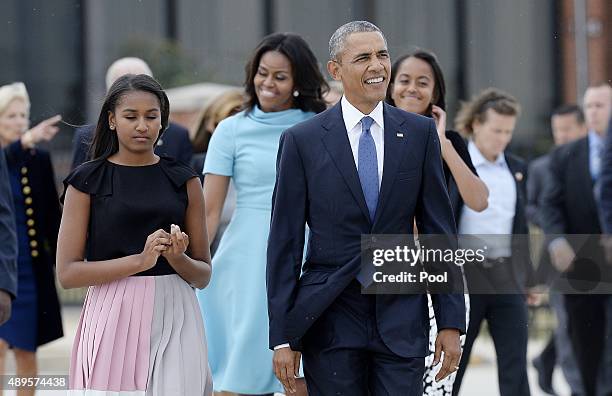 President Barack Obama, daughters Sasha and Malia, and first lady Michelle Obama arrive to greet the Pope September 22, 2015 at Joint Base Andrews,...