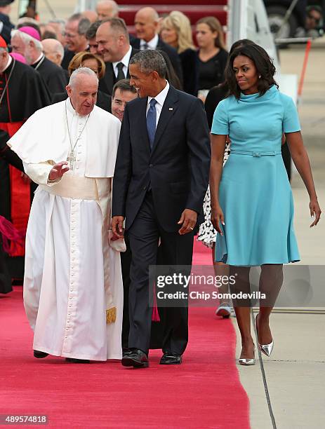 Pope Francis is escorted by U.S. President Barack Obama, first lady Michelle Obama and other political and Catholic church leaders after arriving...