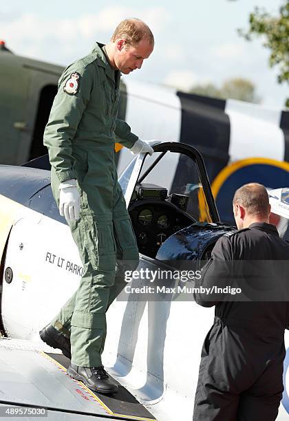 Prince William, Duke of Cambridge disembarks a Chipmunk aircraft after taking a flight during a visit to RAF Coningsby to observe the 100th...