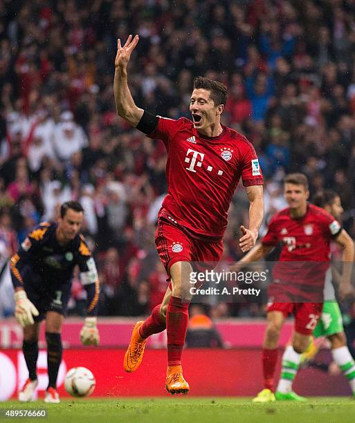 Robert Lewandowski of Bayern Munich celebrates scoring his 4th goal during the Bundesliga match between FC Bayern Muenchen and VfL Wolfsburg at...