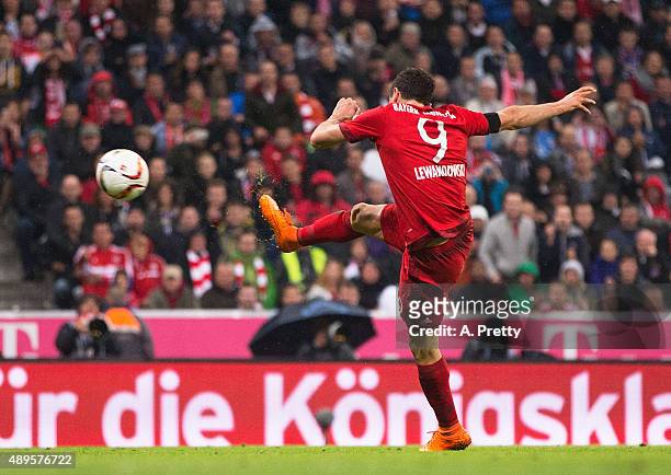 Robert Lewandowski of Bayern Munich scores his 4th goal during the Bundesliga match between FC Bayern Muenchen and VfL Wolfsburg at Allianz Arena on...