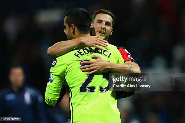 Goalkeeper Adam Federici of Bournemouth celebrates with team mate Dan Gosling of Bournemouth as he saves the decisive kick in the penalty shoot out...