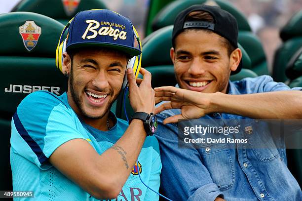 Neymar jokes with Jonathan dos Santos of FC Barcelona prior to the La Liga match between Elche FC and FC Barcelona at Estadio Manuel Martinez Valero...