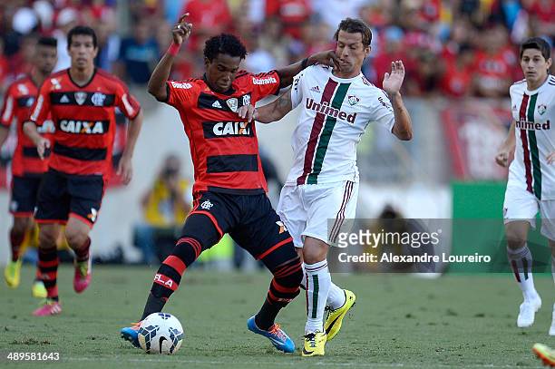 Diguinho of Fluminense battles for the ball with Luiz Antonio of Flamengo during the match between Fluminense and Flamengo as part of Brasileirao...