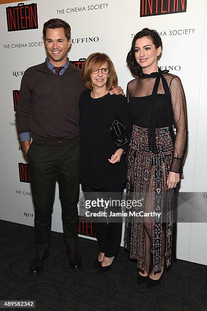 Andrew Rannells, Nancy Meyers and Anne Hathaway attend a screening of Warner Bros. Pictures "The Intern" hosted by The Cinema Society And Ruffino on...