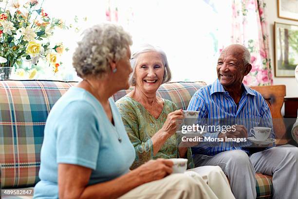 senior people having coffee - retirement community stock pictures, royalty-free photos & images