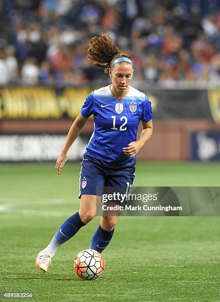 Lauren Holiday of the United States dribbles the ball during the U.S. Women's 2015 World Cup Victory Tour against Haiti at Ford Field on September...