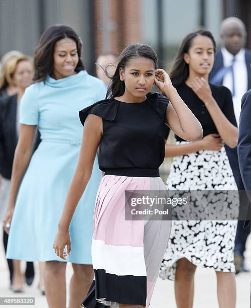 First Lady Michelle Obama with daughters Sasha and Malia arrive to welcome His Holiness Pope Francis on his arrival from Cuba September 22, 2015 at...