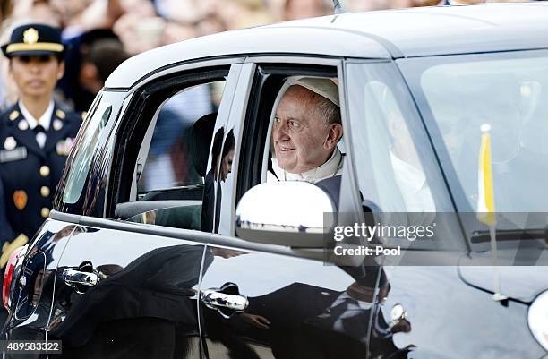 Pope Francis departs in a Fiat after arriving from Cuba September 22, 2015 at Joint Base Andrews, Maryland. Francis will be visiting Washington, New...