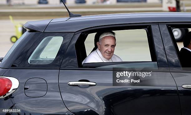 Pope Francis departs in a Fiat after arriving from Cuba September 22, 2015 at Joint Base Andrews, Maryland. Francis will be visiting Washington, New...