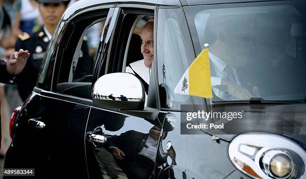 Pope Francis departs in a Fiat after arriving from Cuba September 22, 2015 at Joint Base Andrews, Maryland. Francis will be visiting Washington, New...