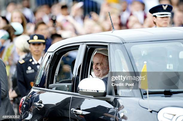 Pope Francis departs in a Fiat after arriving from Cuba September 22, 2015 at Joint Base Andrews, Maryland. Francis will be visiting Washington, New...