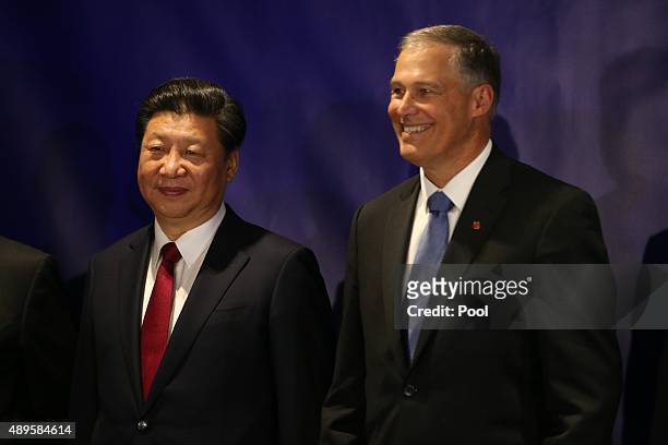 Washington Gov. Jay Inslee stands for a photo with Chinese President Xi Jinping before a forum for U.S. And Chinese governors September 22, 2015 in...