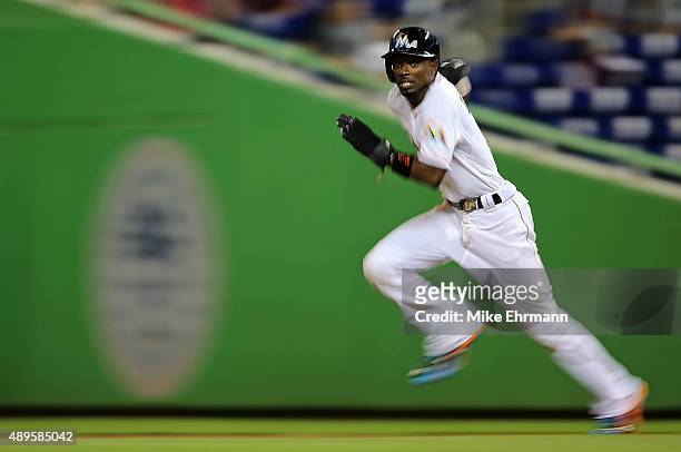 Dee Gordon of the Miami Marlins runs to second during a game against the Philadelphia Phillies at Marlins Park on September 22, 2015 in Miami,...