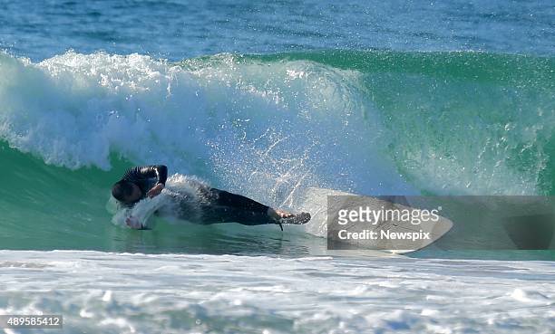 Former Prime Minister Tony Abbott goes for a surf at North Steyne before coffee with friends in Sydney, New South Wales.