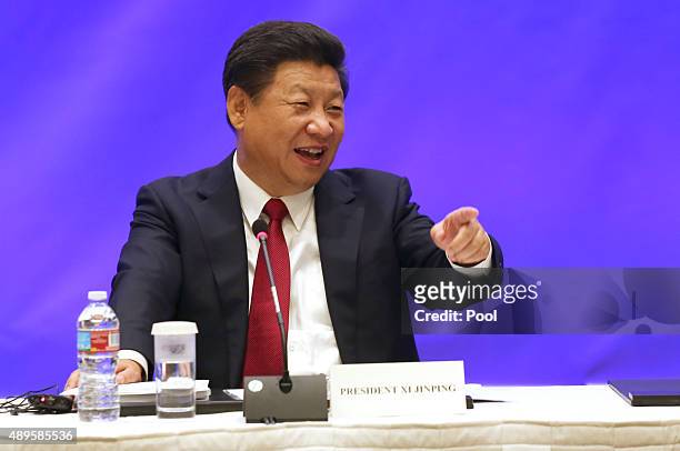 Chinese President Xi Jinping speaks during a meeting with five United States governors to discuss clean technology and economic development September...