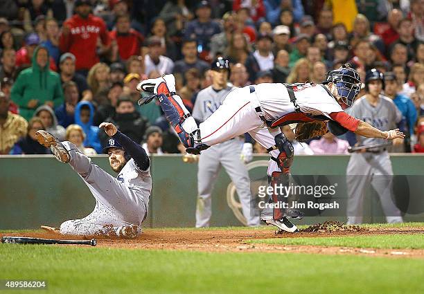 Steven Souza Jr. #20 of the Tampa Bay Rays is out at the plate as Blake Swihart of the Boston Red Sox turns a double play in the seventh inning at...