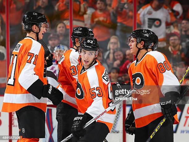 Shayne Gostisbehere of the Philadelphia Flyers celebrates his goal with teammates Travis Sanheim,Aaron Palushaj and Travis Konecny in the third...