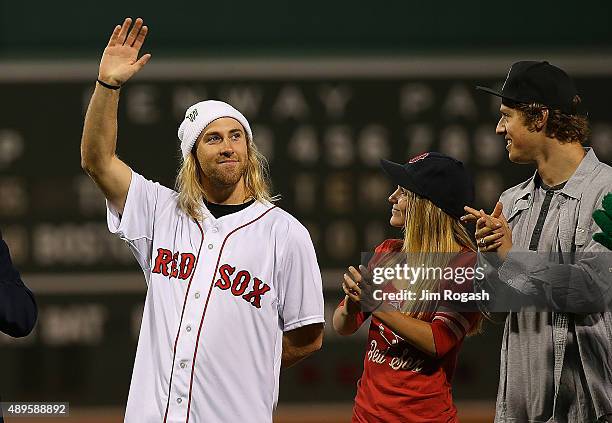 Olympic gold medalist Sage Kotsenburg waves before throwing out the first pitch before a game with Tampa Bay Rays at Fenway Park on September 22,...
